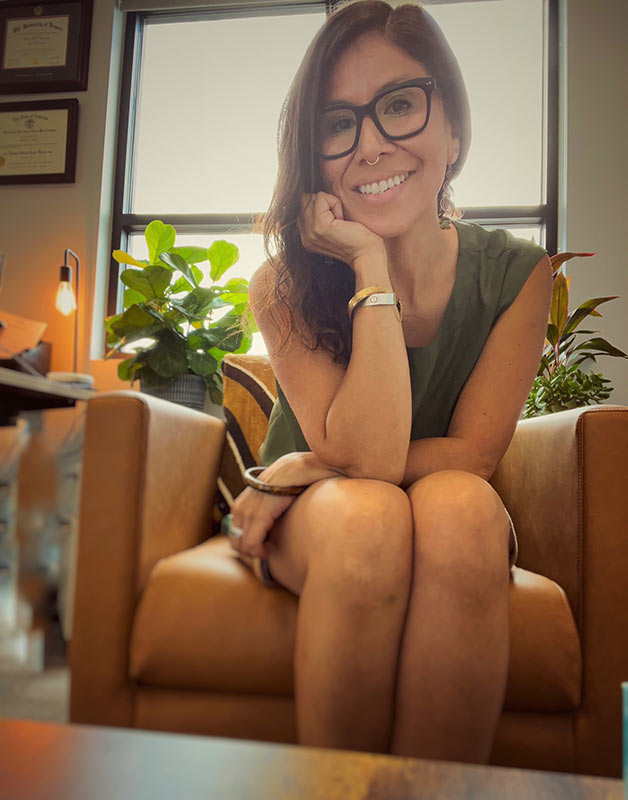 Juliana Vergaray seated in her office